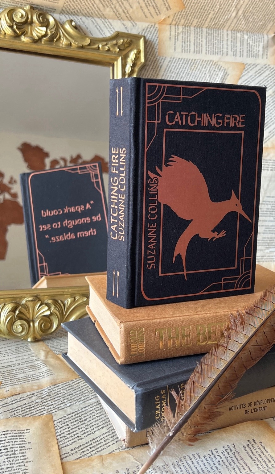 The Hunger Games trilogy with custom art on book edges