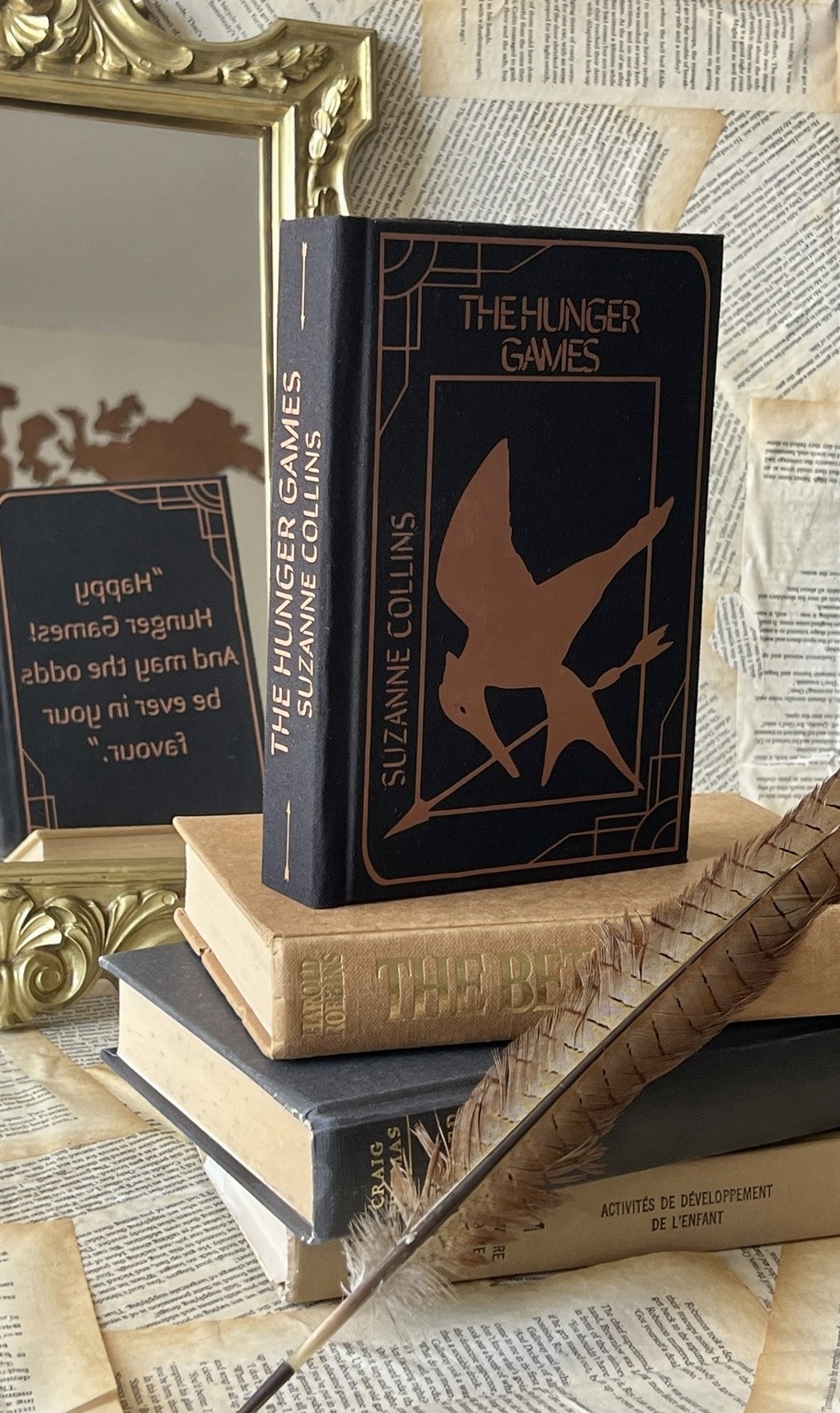 The Hunger Games trilogy with custom art on book edges