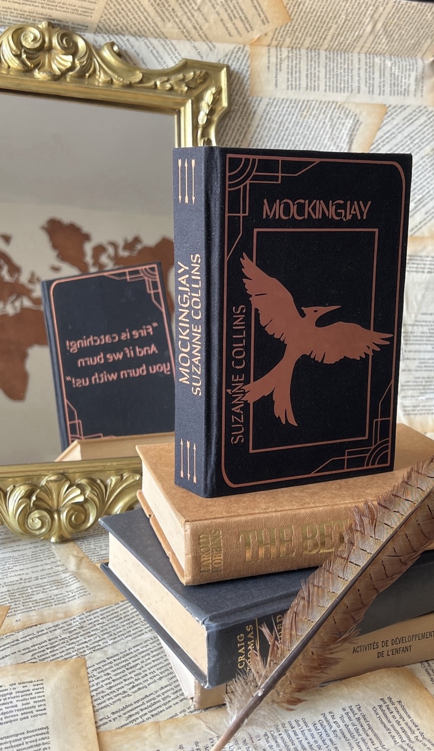 The Hunger Games trilogy with custom art on book edges