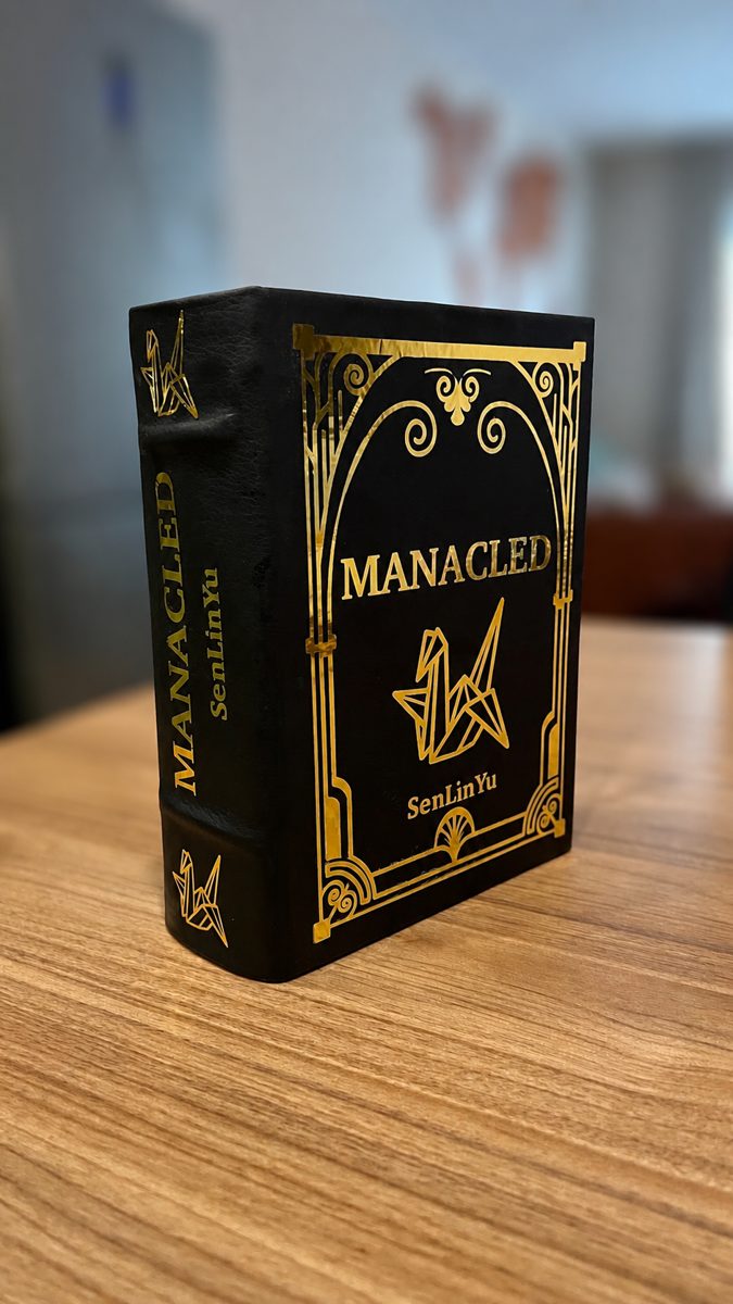 Manacled rebind, black leather with gold foil detailing